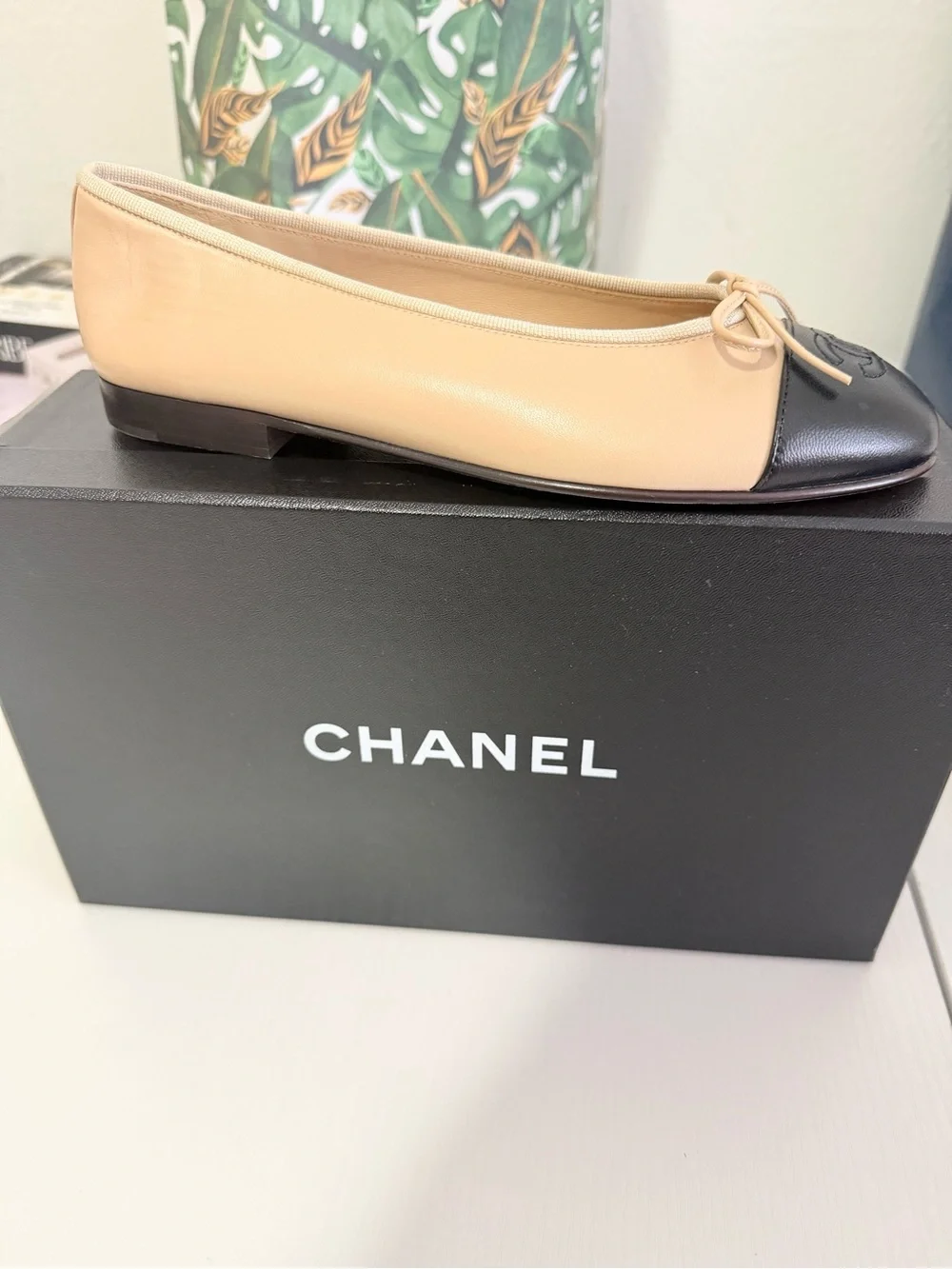 CHANEL Beige and Black Leather Cap-Toe Ballet Flats - Picture 2 of 3